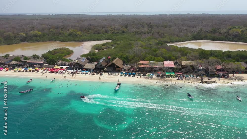 Beautiful tropical sandy exotic beach with sunbeds and sun umbrellas aerial panorama view. Beautiful tropical sandy exotic beach with sunbeds and sun umbrellas aerial panorama view.