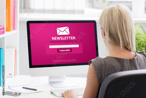 Woman subscribing to newsletter on some website