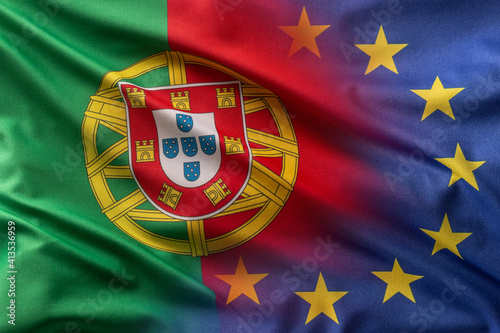 Fotografie Flags of Portugal and EU blowing in the wind