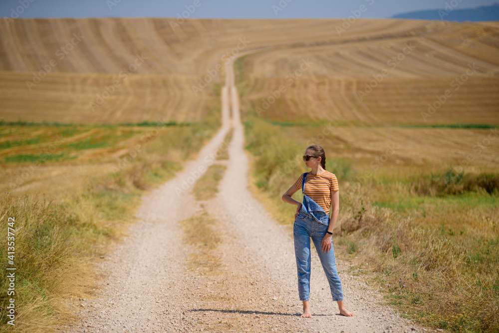 girl on the road with wheat field girl on the road with wheat field