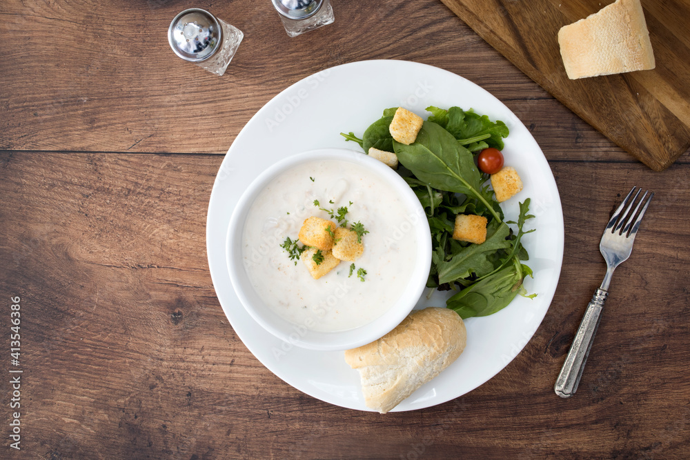 A Bowl of Clam Chowder and a Salad A Bowl of Clam Chowder and a Salad