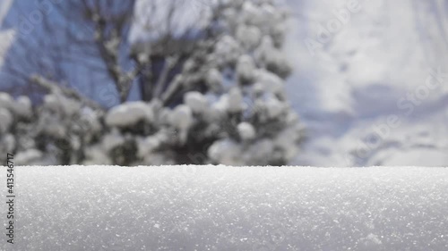 beautiful frosty winter morning, view from the window. In the foreground snow on a bokeh background 