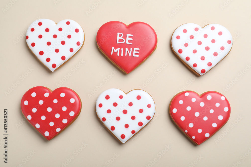Delicious heart shaped cookies on beige background, flat lay. Valentine's Day