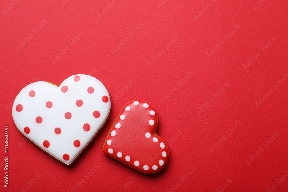 Valentine's day cookies on red background, flat lay. Space for text Valentine's day cookies on red background, flat lay. Space for text