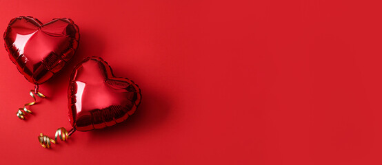 Heart shaped balloons on red background, flat lay with space for text. Saint Valentine's day celebration