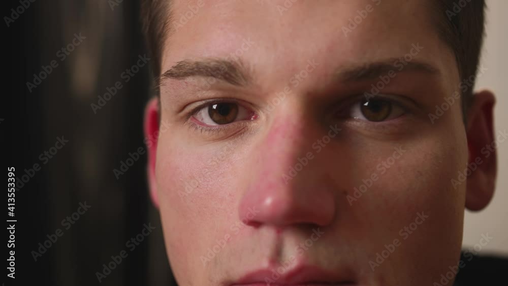 Closeup of man Face looking at camera, man has beautiful brown Eyes. Natural Beauty. Slow motion. Closeup of man Face looking at camera, man has beautiful brown Eyes. Natural Beauty. Slow motion.