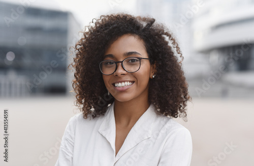 Fotografie, Obraz Young beautiful woman portrait, African student girl in a city, Young businesswo