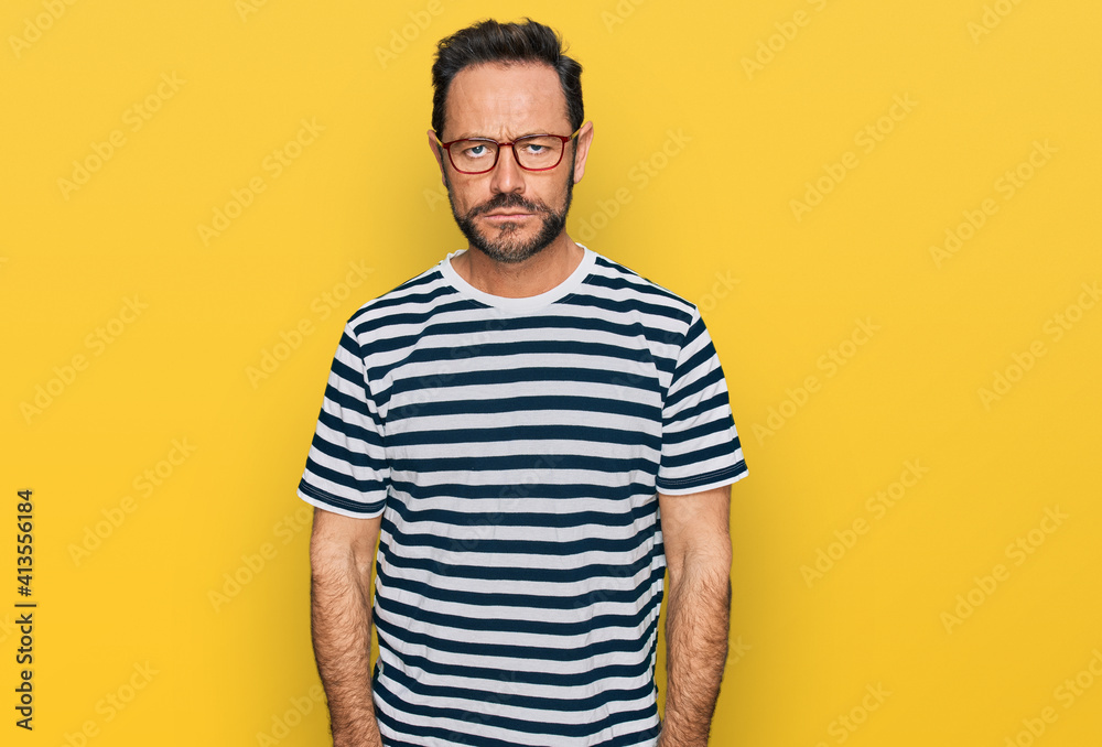 Middle age man wearing casual clothes and glasses depressed and worry for distress, crying angry and afraid. sad expression. Middle age man wearing casual clothes and glasses depressed and worry for distress, crying angry and afraid. sad expression.