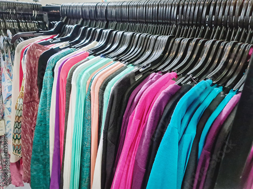 Colorful Blouses for Ladies Hanging on Rack for Sale at Clothing Store