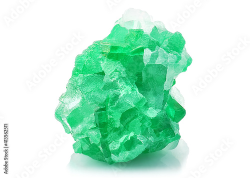 Amazing closeup macro of natural raw Emerald rough mineral stone on white background. High quality photo of green Emerald gemstone crystal for jewelry