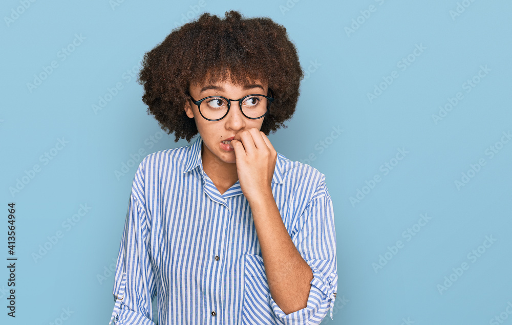 Young hispanic girl wearing business shirt and glasses looking stressed and nervous with hands on mouth biting nails. anxiety problem. Young hispanic girl wearing business shirt and glasses looking stressed and nervous with hands on mouth biting nails. anxiety problem.
