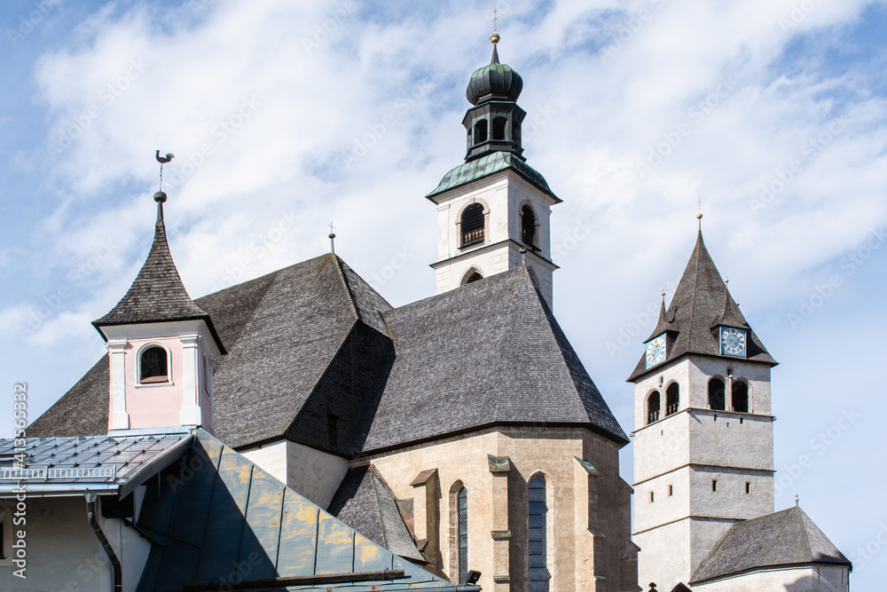 An old church with a bell tower in the center of the legendary ski Kitzbuhel
