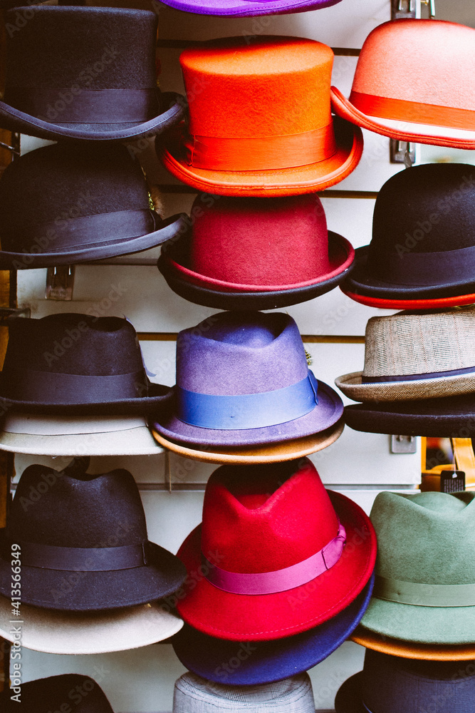 stacked colorful hats in market