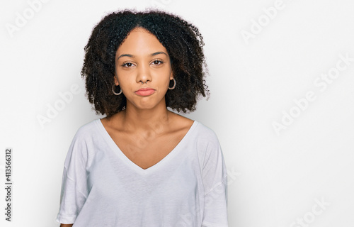 Young african american girl wearing casual clothes depressed and worry for distress, crying angry and afraid. sad expression. © Krakenimages.com