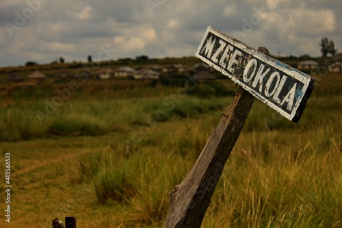 mzee okola, village sign, kenya, afrika photo