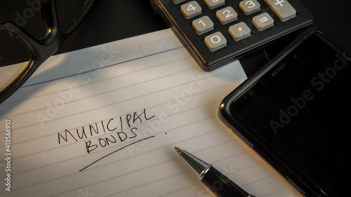 Municipal bond written on a book  and documents.