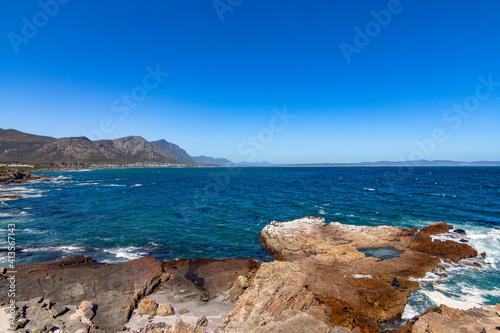 Cliff at blue sea at Hermanus south Africa