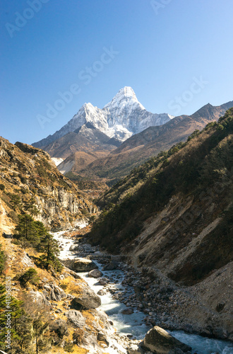 river in the mountains in autumn, mountain river in the mountains, ama dablam peak on the way to Everest Base Camp, trekking and hiking in Nepal, beautiful landscape in Sagarmatha National Park