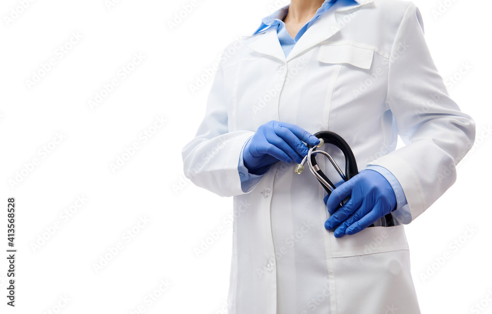 Hands in gloves holding a stethoscope in the pocket of a white medical care gown. Isolated on white background with copy space. Hands in gloves holding a stethoscope in the pocket of a white medical care gown. Isolated on white background with copy space.