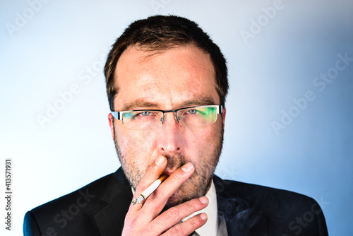 Man pulls on cigarette