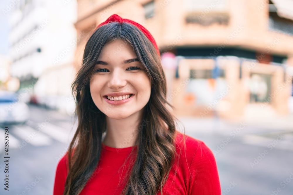 Young caucasian woman smiling happy walking at the city.