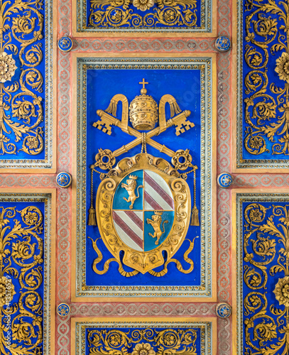 Pope Pius IX emblem on the coiling of the Basilica of San Nicola in Carcere in Rome, Italy. 
