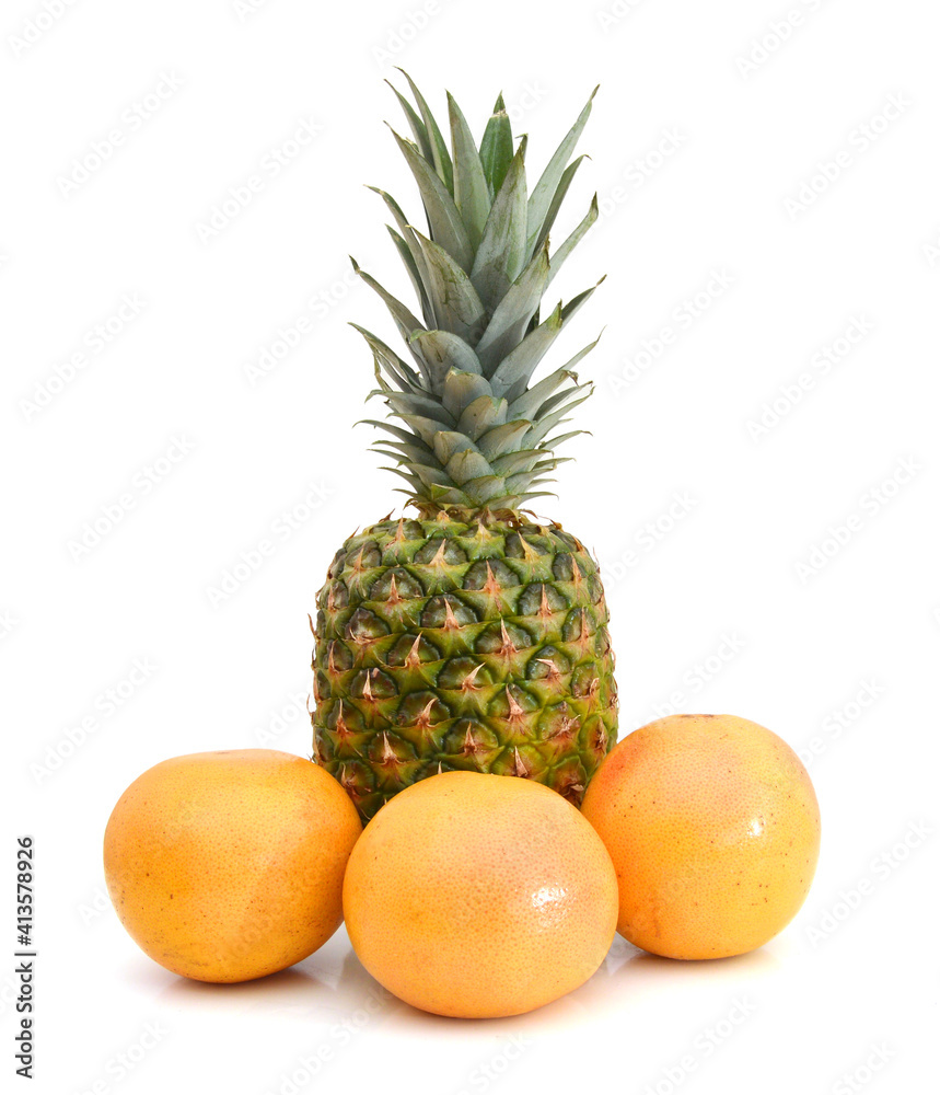 Grapefruits and pineapple on white background Grapefruits and pineapple on white background