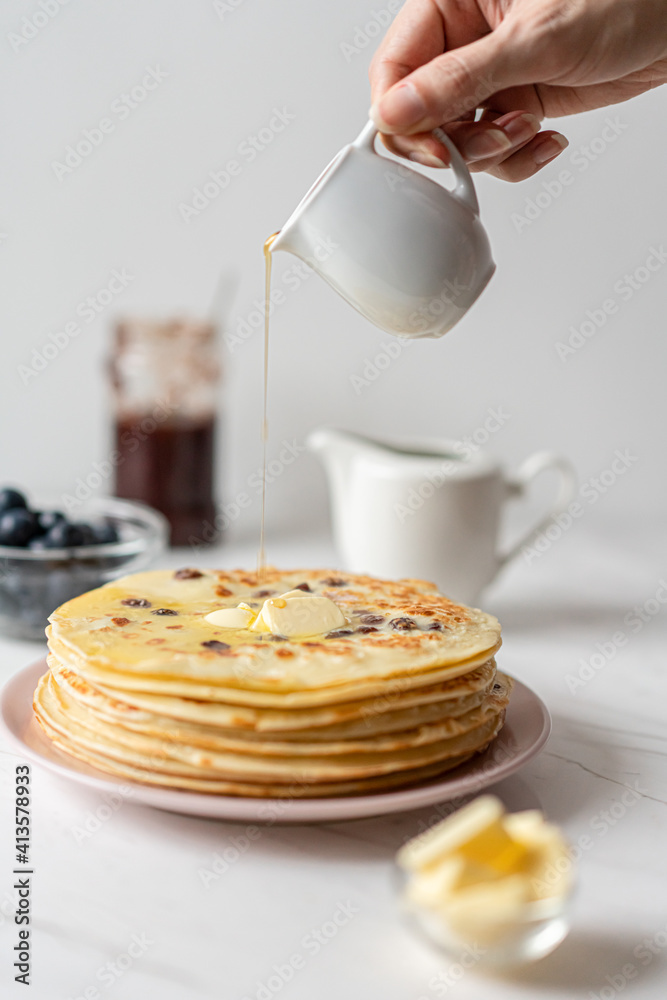 French Pancakes With Raisins served with Butter and Maple Syrup, Morning Breakfast French Pancakes With Raisins served with Butter and Maple Syrup, Morning Breakfast