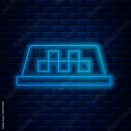 Glowing neon line Taxi car roof icon isolated on brick wall background. Vector.