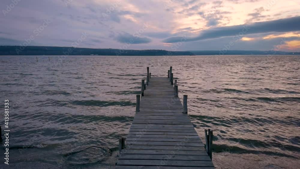 Idyllic view from the seashore with a wooden pier. Time for relaxing Idyllic view from the seashore with a wooden pier. Time for relaxing