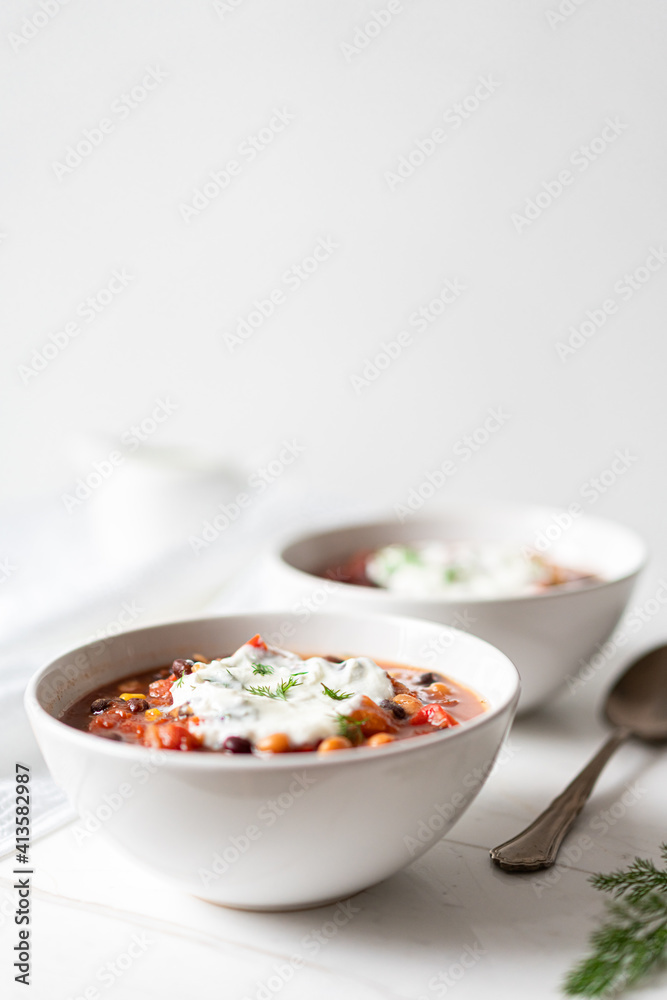 Vegetable Chili Bean Stew With Red Kidney Beans, Tomatoes, Sweetcorn, Red and Yellow Peppers On Flat Lay Vegetable Chili Bean Stew With Red Kidney Beans, Tomatoes, Sweetcorn, Red and Yellow Peppers On Flat Lay