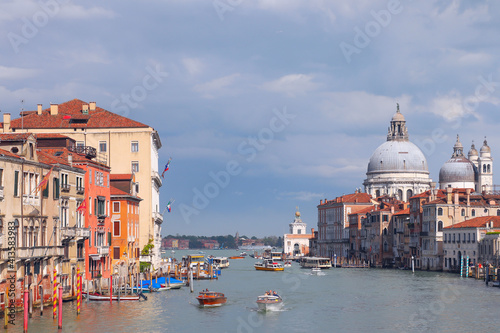 Traffic on the Grand Canal in the early morning. Dome Basilica di Santa Maria della Salute. Famous views of Venice