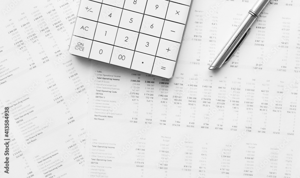 Calculator with pen on stock market analysis. Concept of Business, Finance and Audit research. Calculator with pen on stock market analysis. Concept of Business, Finance and Audit research.