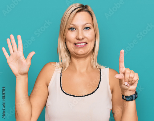 Middle age caucasian woman wearing casual clothes showing and pointing up with fingers number six while smiling confident and happy.