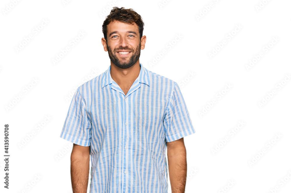 Fototapeta premium Handsome young man with beard wearing casual fresh shirt with a happy and cool smile on face. lucky person.