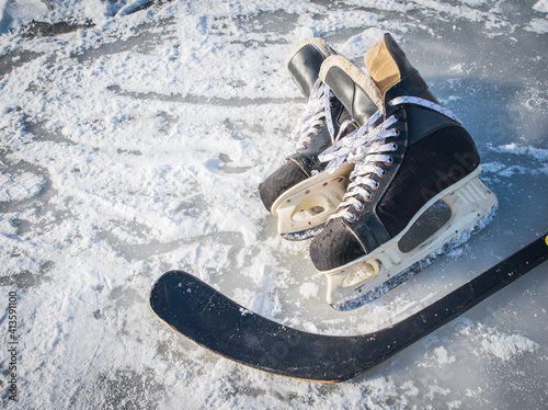 Wallpaper Mural Details close up hockey scates on a frozen pond. Ice skating in nature at sunset in winter. Travel and sports Torontodigital.ca