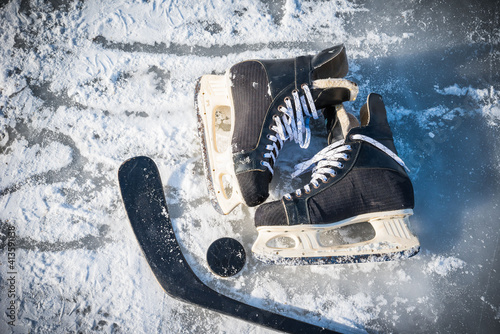 Wallpaper Mural Details close up hockey scates on a frozen pond. Ice skating in nature at sunset in winter. Travel and sports Torontodigital.ca