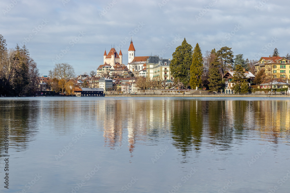 Thun city old town skyline with castle and church reflected in the aare river on sunny day, canton bern switzerland. Thun city old town skyline with castle and church reflected in the aare river on sunny day, canton bern switzerland.