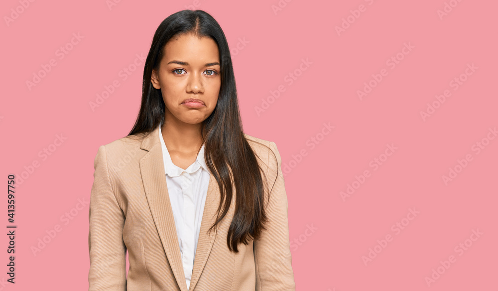 Beautiful hispanic woman wearing business jacket depressed and worry for distress, crying angry and afraid. sad expression.