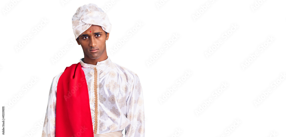 African handsome man wearing tradition sherwani saree clothes depressed and worry for distress, crying angry and afraid. sad expression. African handsome man wearing tradition sherwani saree clothes depressed and worry for distress, crying angry and afraid. sad expression.