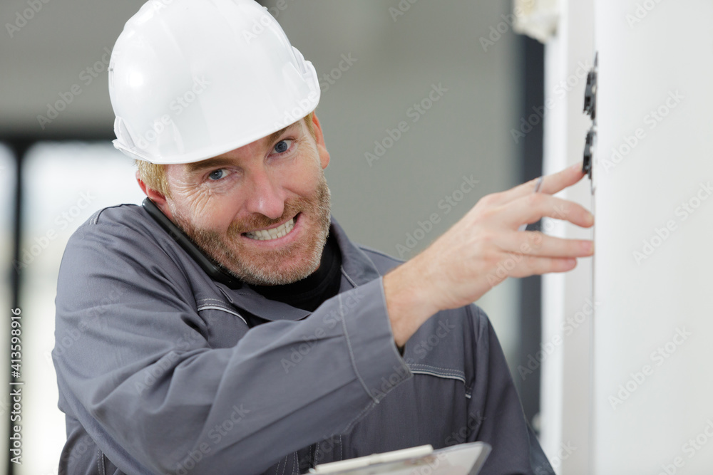 electrician installing socket in new house electrician installing socket in new house