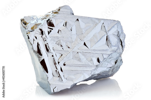 Macro shoot of piece of nickel metal ore isolated on a white background. Closeup photo of amazing shiny mineral rough