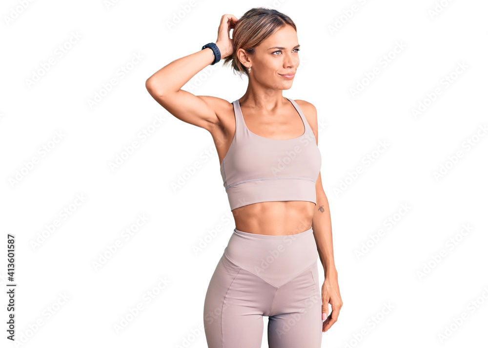 Beautiful caucasian woman wearing sportswear confuse and wondering about question. uncertain with doubt, thinking with hand on head. pensive concept. Beautiful caucasian woman wearing sportswear confuse and wondering about question. uncertain with doubt, thinking with hand on head. pensive concept.