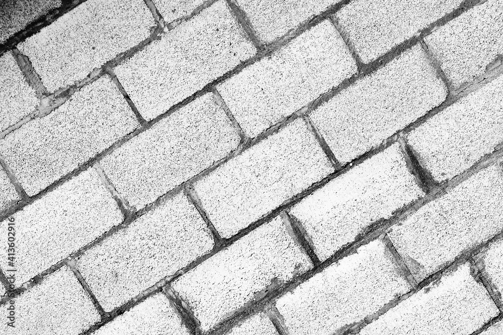 Texture of a brick wall with cracks and scratches which can be used as a background Texture of a brick wall with cracks and scratches which can be used as a background