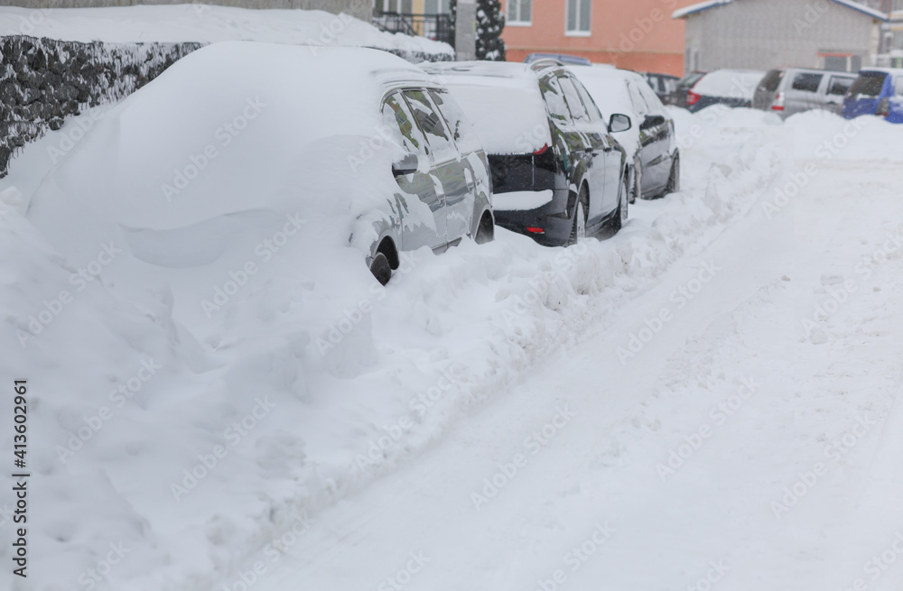 Parking in heavy snowfall. A car covered in snow. Snowstorm Parking in heavy snowfall. A car covered in snow. Snowstorm