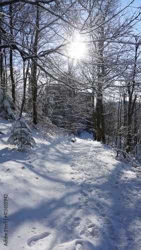 the snowy trail from the Ritterplatte (knight plate) down to the Altes Schloss (old castle) Hohenbaden, at the Battert, a panorama path in Baden-Baden in the region Baden-Wuerttemberg, Germany © Miriam