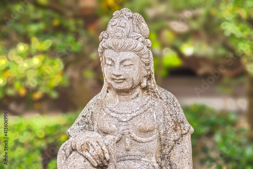 Close up on the stone statue depicting the bust of the Japanese bodhisattva Monju Bosatsu symbolizing wisdom and intelligence in the Buddhist Togakuji temple of Tabata. © kuremo