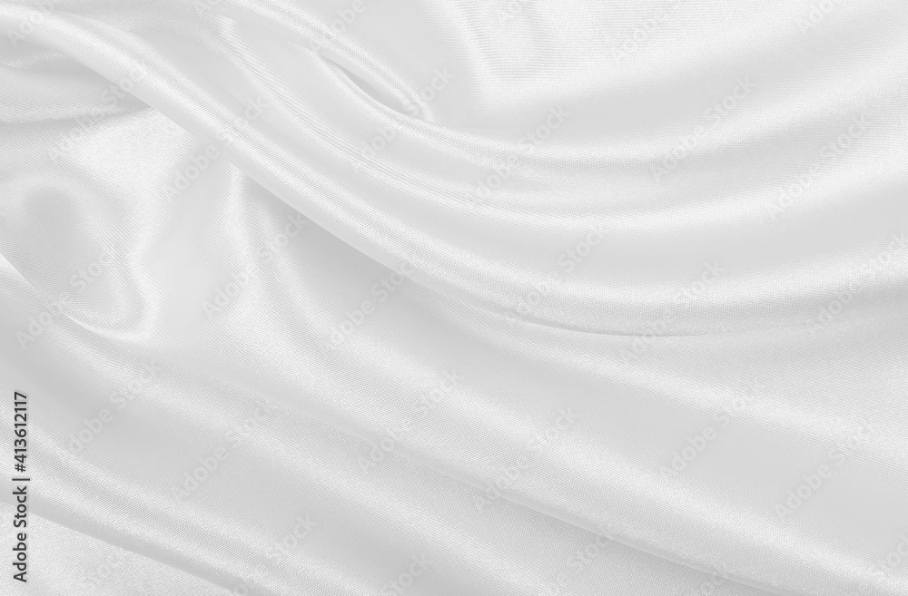Smooth elegant white silk or satin luxury cloth texture as wedding background. Luxurious background design Smooth elegant white silk or satin luxury cloth texture as wedding background. Luxurious background design