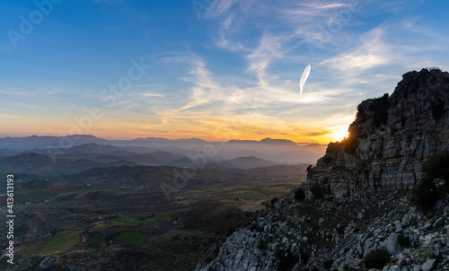 landscape view of the el Torcal rock formations and the Montes de Malaga Nature Park in Andalusia at sunset