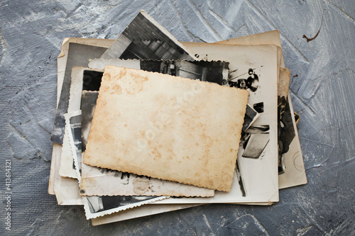 Slika na platnu Stack old photos  on grey background